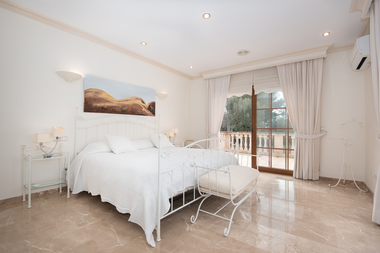 Bright bedroom with balcony access