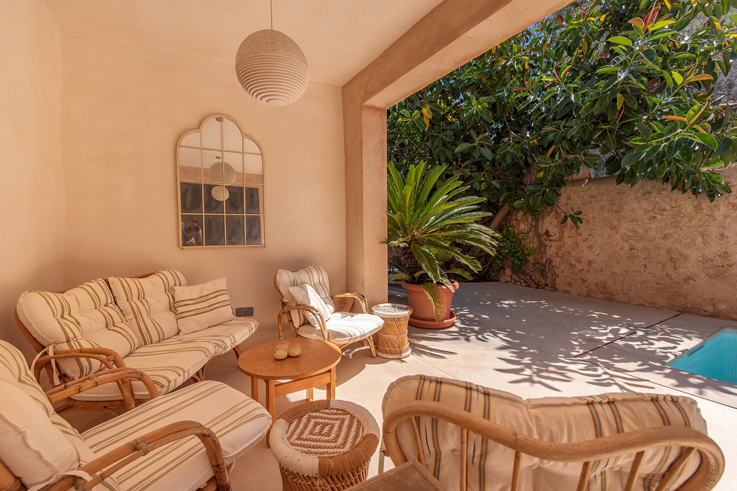 Covered terrace as a serene retreat overlooking the courtyard