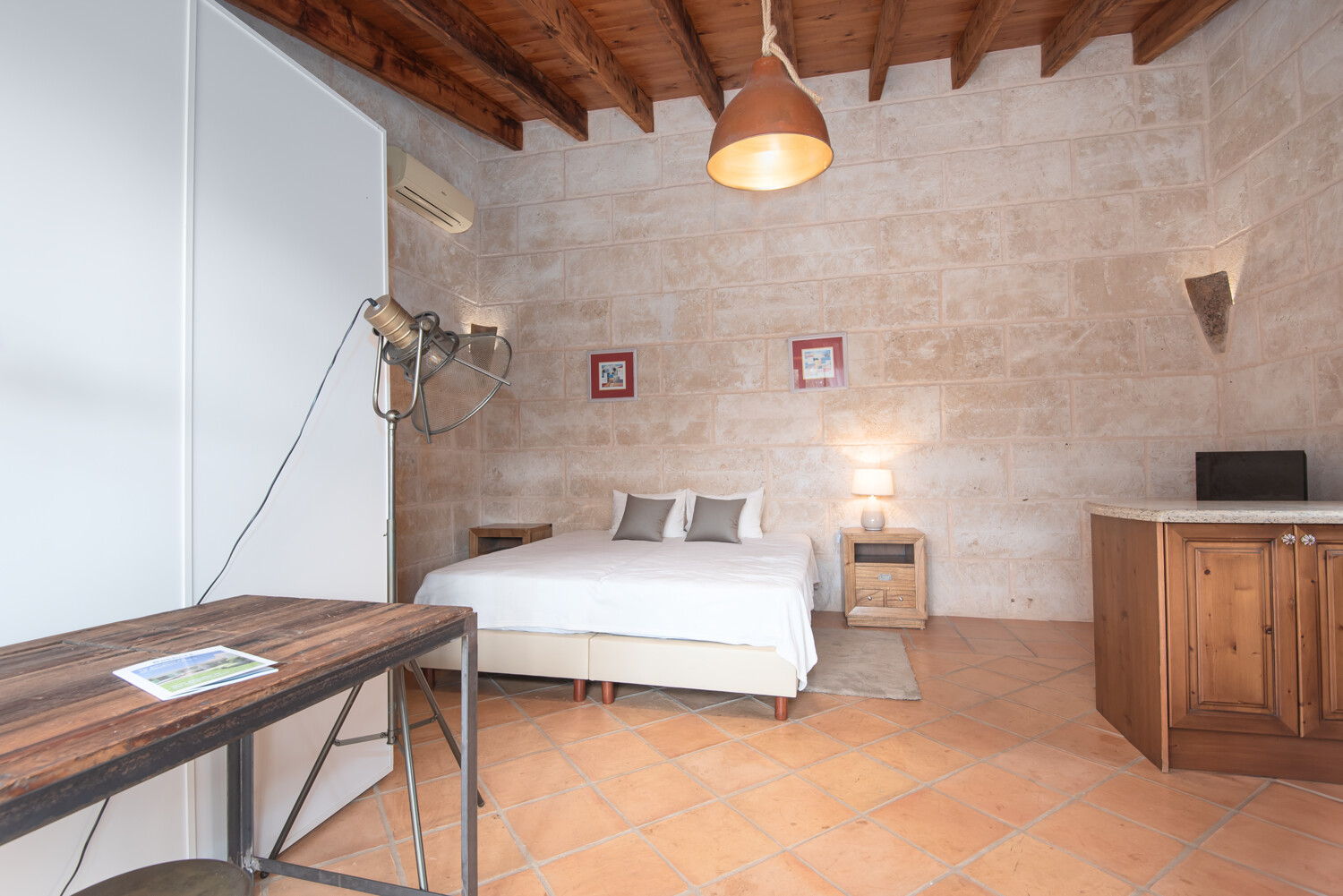 Charming guest room with rustic wooden beams