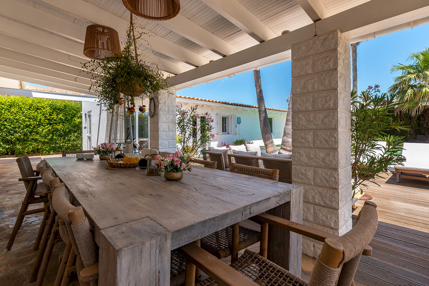Villa behind with covered terrace