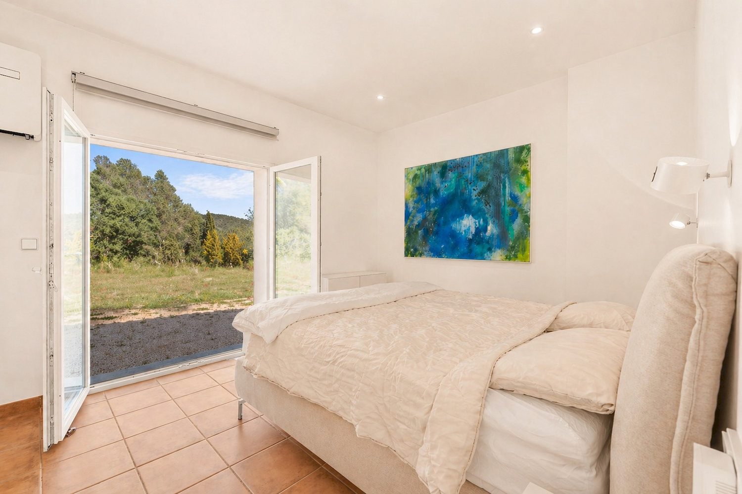 Serene bedroom with direct garden access and abundant natural light