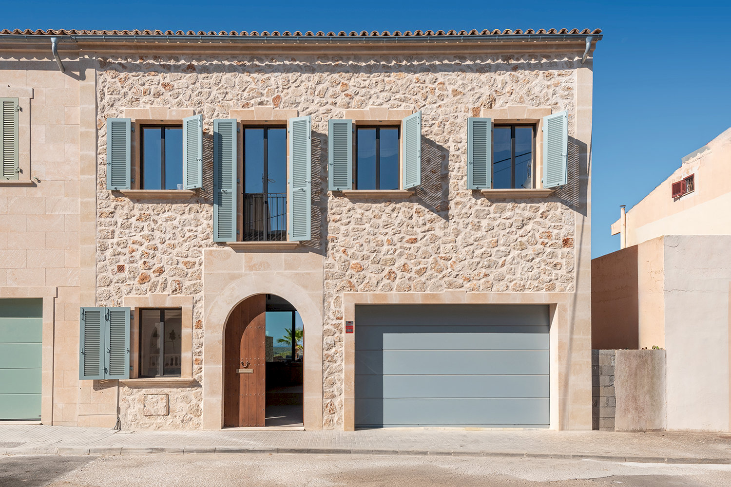 Front view of the house with natural stone facade