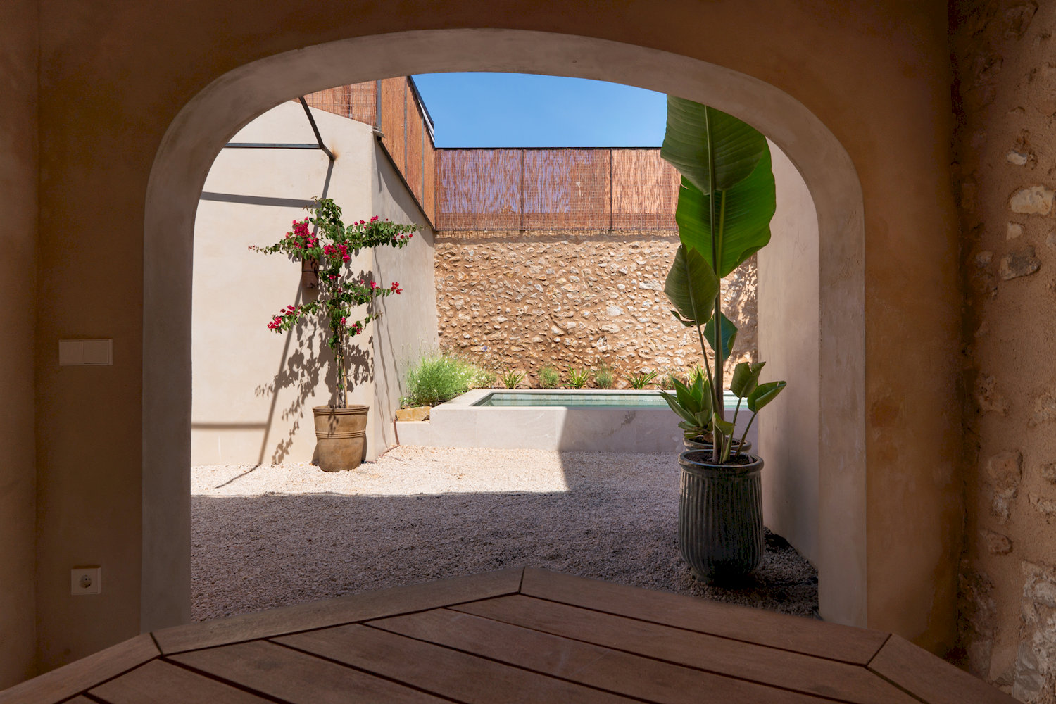 Stone arch access to the patio