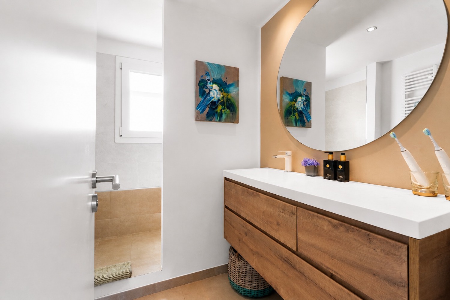 Stylish bathroom with a large vanity and walk-in shower