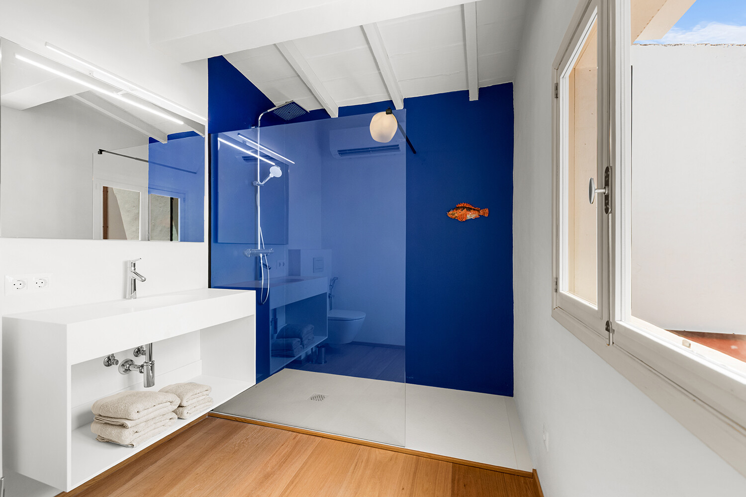 Modern bathroom with generous walk-in shower and clean minimalist design