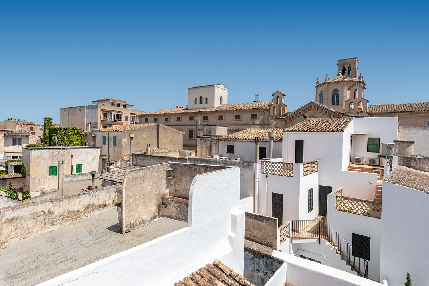 Panoramic view from the roof terrace across the rooftops and historic landmarks of Felanitx